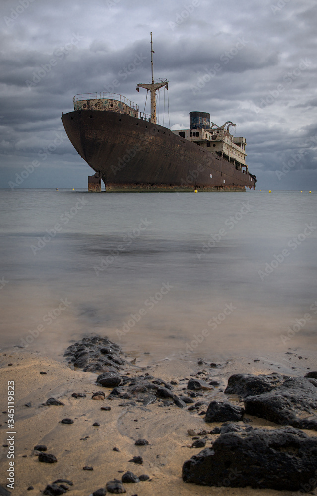 rusting sunken stranded ghost ship near the harbour of Arrecife on Lanzarote one of the Canarie Islands rusting sunken stranded ghost ship near the harbour of Arrecife on Lanzarote one of the Canarie Islands