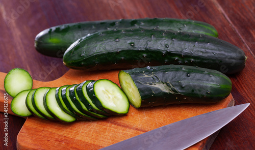 Canvas Print Fresh cucumbers with chopped slices