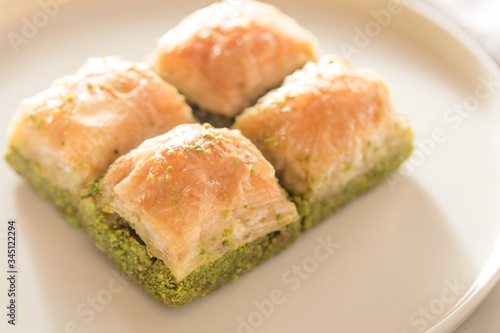 Traditional, delicious Turkish baklava on white plate