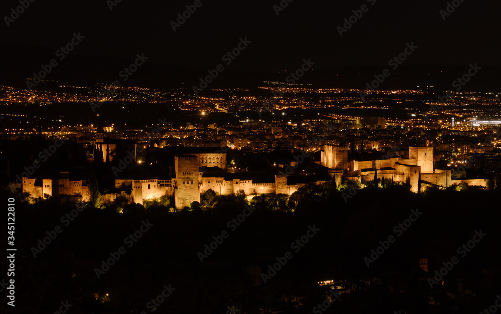 Night image of the Moorish fortifications of the Alhambra in Granada, Andalucia, Spain.
