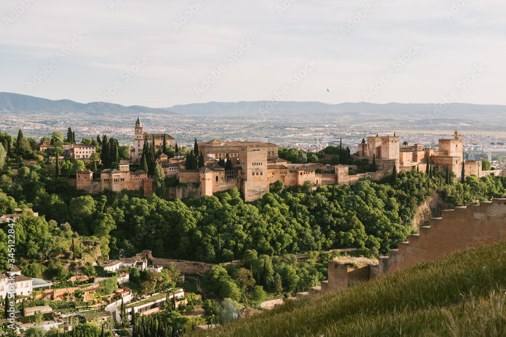 View from above of the Alhambra fortification with the city of Granada in the background.