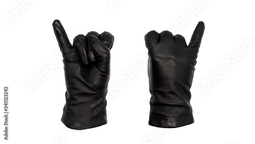 Hands wearing black leather gloves with little finger raised, view from front and back. Female hand isolated, no skin