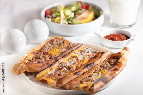 Traditional Turkish pide with meat and egg