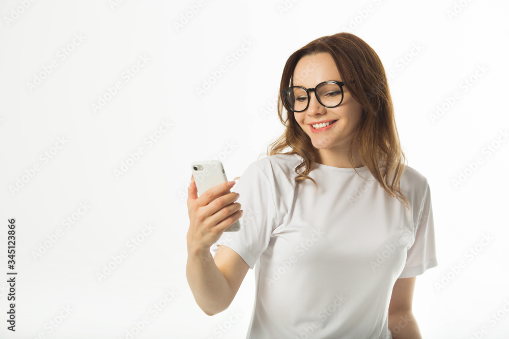 beautiful young woman in a white t-shirt on a white background beautiful young woman in a white t-shirt on a white background