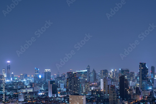 Bangkok city scape at night in blue tone with top copy space for your decide.