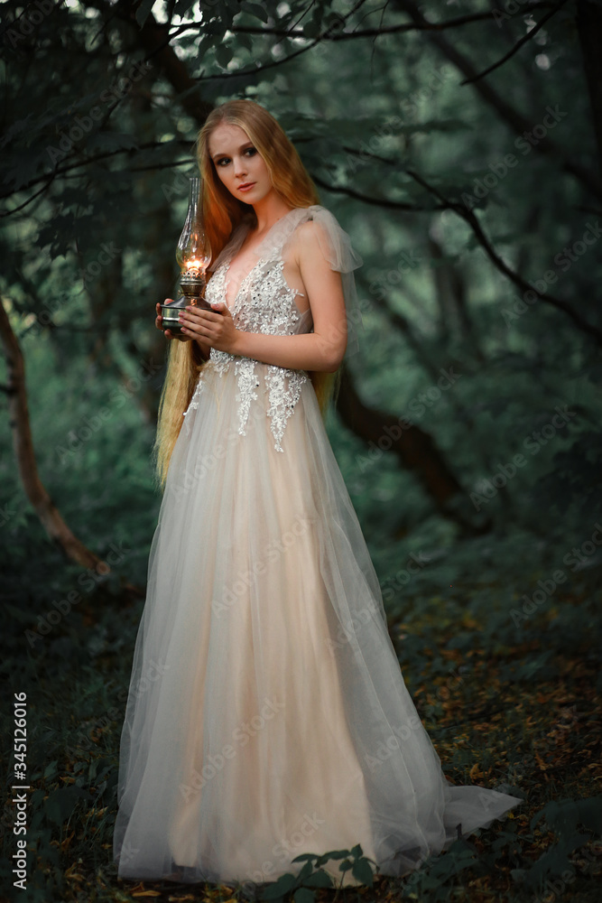 long haired blonde girl in white dress with lantern