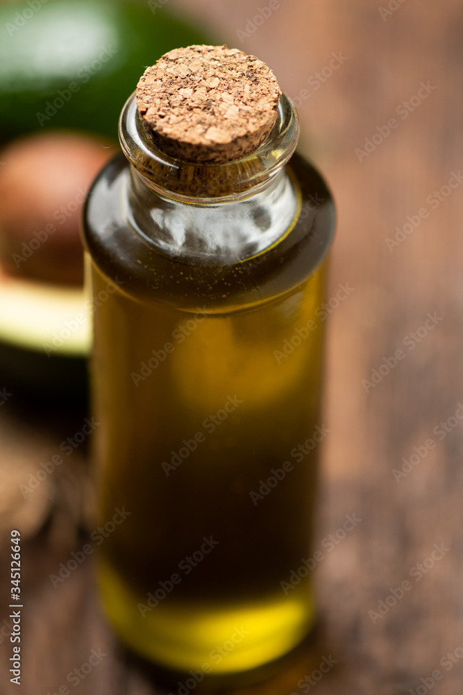An avocado Oil on wooden background