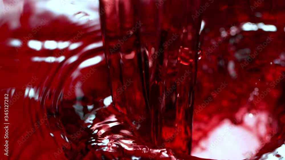Super Slow Motion Detail Shot of Pouring Red Wine at 1000fps. Super Slow Motion Detail Shot of Pouring Red Wine at 1000fps.