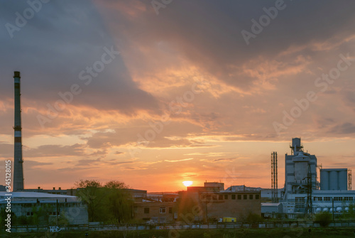 Heavy industry factory building on sunset background