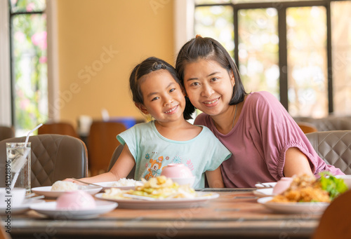 Mother and daughter smile happily