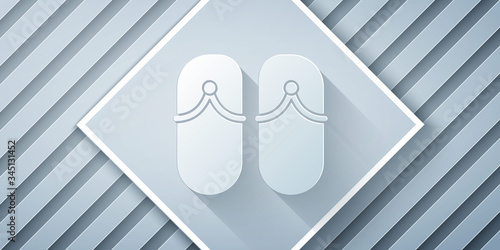 Paper cut Flip flops icon isolated on grey background. Beach slippers sign. Paper art style. Vector Illustration
