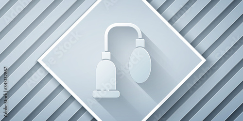 Paper cut Penis pump icon isolated on grey background. Penis enlarger. Sex toy for men. Vacuum pump with a blower to increase the penis. Paper art style. Vector Illustration