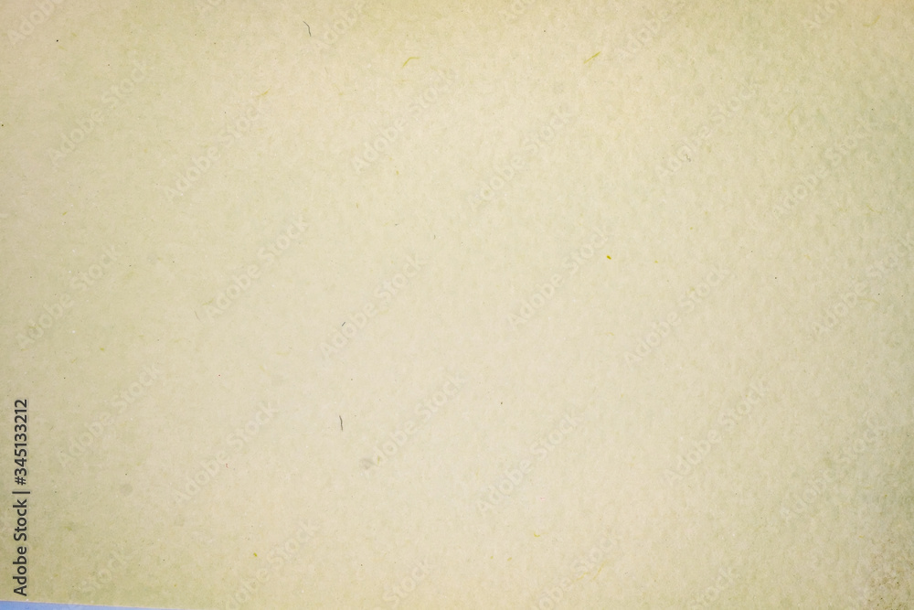 A dense industrial sheet of grey paper with a textured surface A dense industrial sheet of grey paper with a textured surface