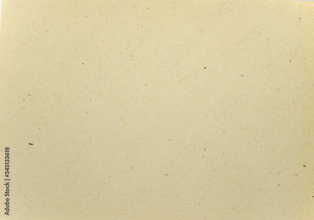 A dense industrial sheet of grey paper with a textured surface A dense industrial sheet of grey paper with a textured surface