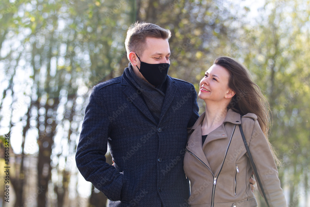 Masked couple walking in the park Masked couple walking in the park
