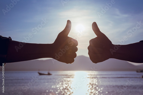 Businessman showing thumbs up, Successful business. Close-up view of the thumbs up.