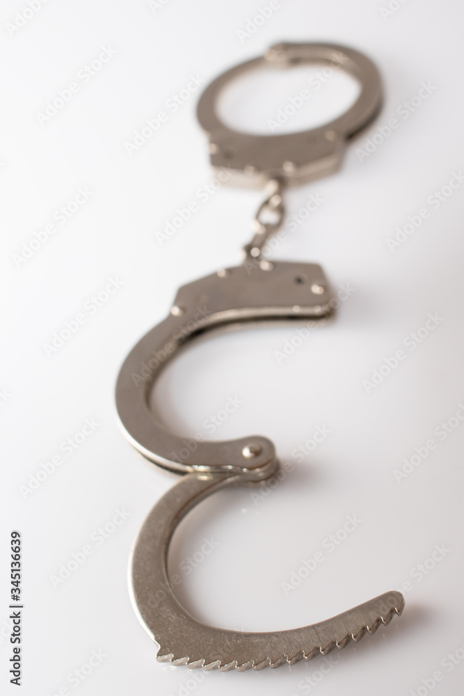 steel metal Handcuffs on white background isolate steel metal Handcuffs on white background isolate