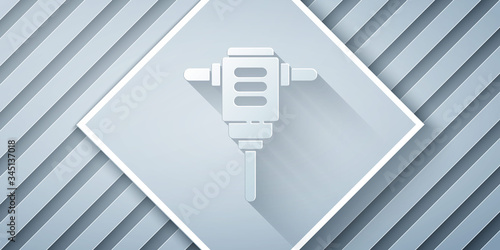 Paper cut Electric rotary hammer drill machine icon isolated on grey background. Working tool for construction, finishing, repair work. Paper art style. Vector Illustration