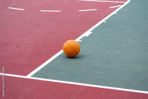 Basketball on empty sports court