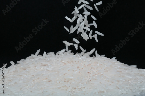 Rice Grains Falling on a pile Macro