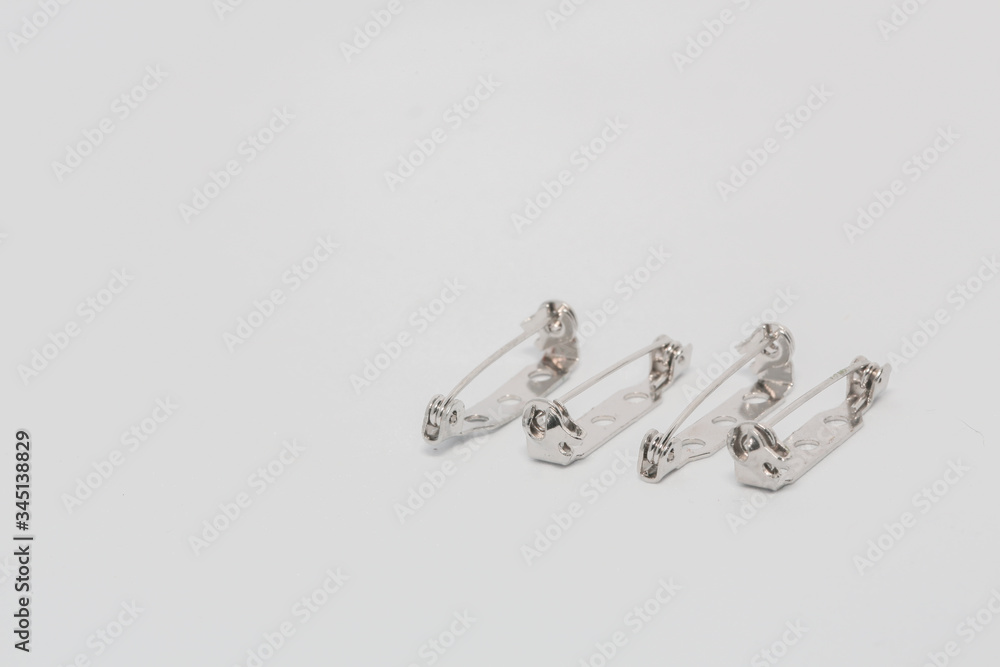 Safety Pins displayed on white background Safety Pins displayed on white background