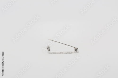 Safety Pins displayed on white background