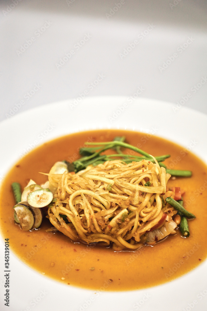 Green Papaya Salad (Som tum Thai) on white background
Green Papaya Salad (Som tum Thai) on white background