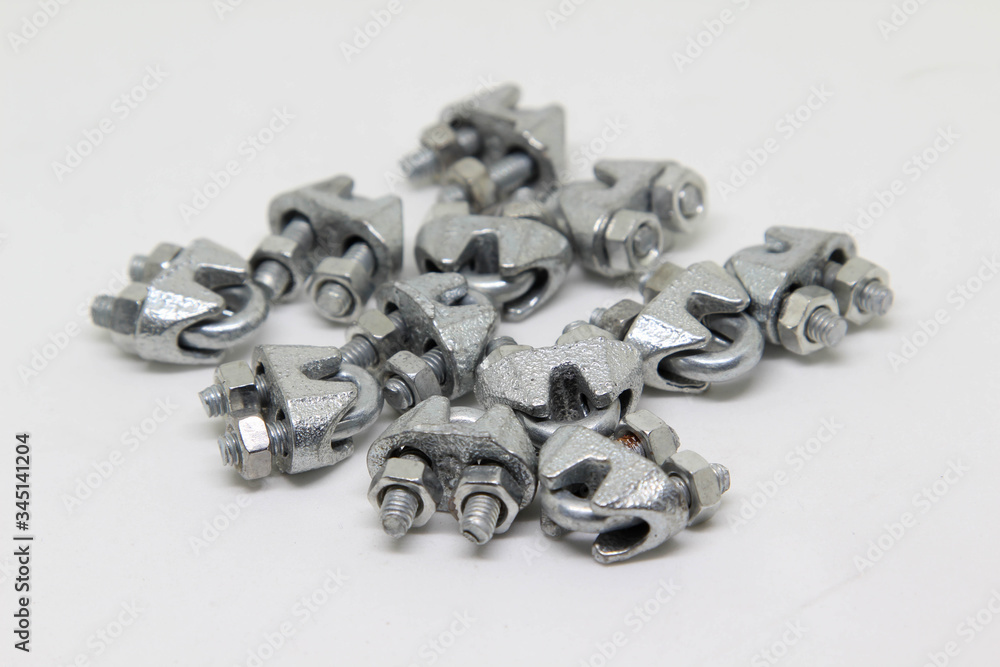 Cable fasteners or wire rope clips on white background. Cable fasteners or wire rope clips on white background.