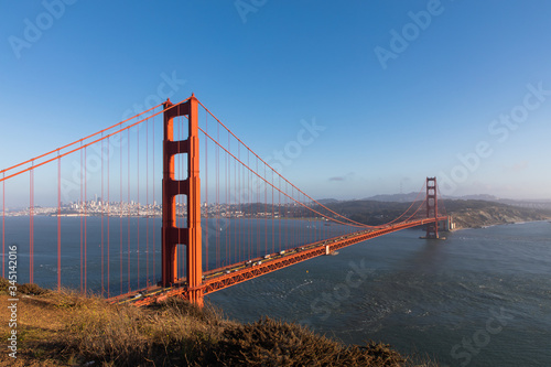 Clear and sunny view of the Golden Gate Bridge from Vista Point. Landscape shot of Golden Gate Bridge. Big red bridge over the river. © Suhail