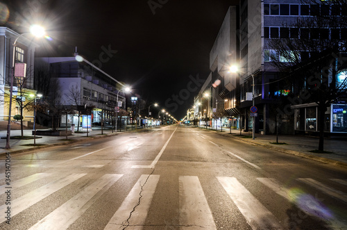 Empty streets by night. Cities declares curfew to stop spread of coronavirus. 2019-nCov. Curfew to contain the spread of the coronavirus.  photo