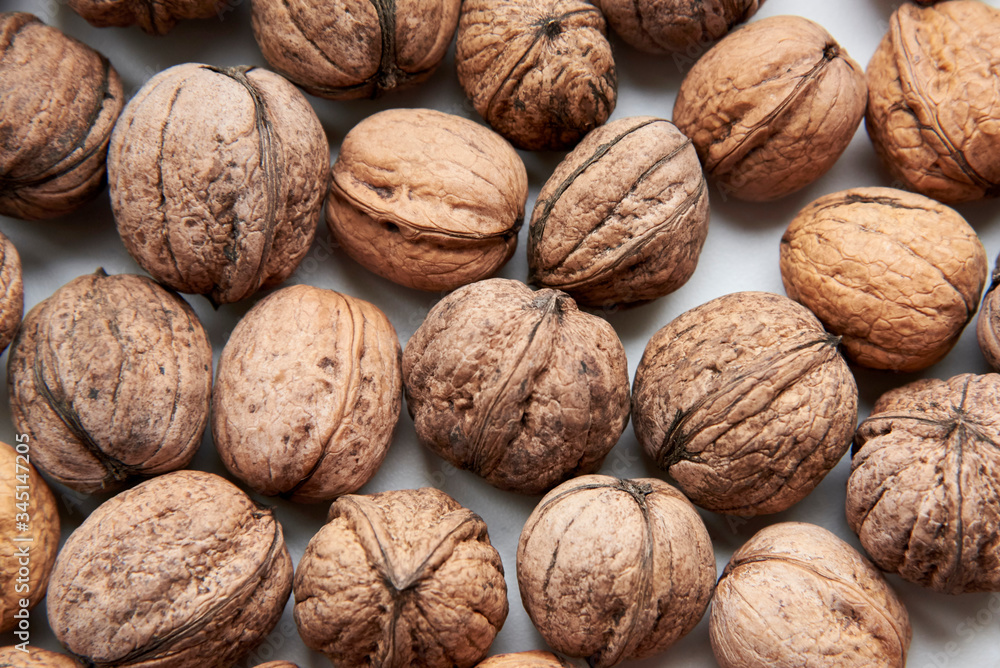 Inshell ripe walnut, the theme of healthy nutrition, vegetarianism. Inshell ripe walnut, the theme of healthy nutrition, vegetarianism.