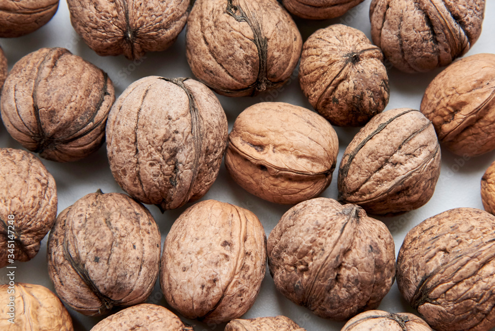 Inshell ripe walnut, the theme of healthy nutrition, vegetarianism. Inshell ripe walnut, the theme of healthy nutrition, vegetarianism.