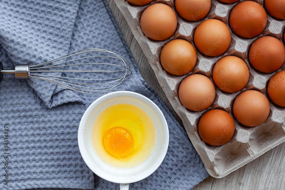 Whisk egg near the brown eggs Whisk egg near the brown eggs