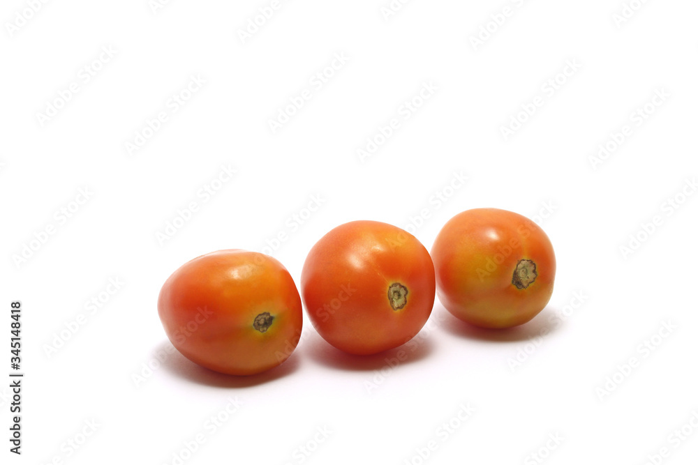 Three tomatoes (Solanum lycopersicum) isolated on white background Three tomatoes (Solanum lycopersicum) isolated on white background
