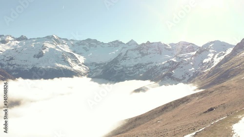 DRONE FOOTAGE - Snow and mountain peaks in the french Pyrenees near the Luchon Superbagnères Ski Resort in Saint-Aventin, France. The Luchonnais Mountains aerial view.