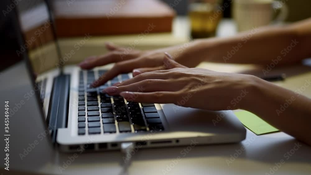 Quarantine. isolation, social distancing, freelance work from home office, self-isolation. Young business woman is typing on laptop keyboard and writing. Coronavirus. Quarantine. isolation, social distancing, freelance work from home office, self-isolation. Young business woman is typing on laptop keyboard and writing. Coronavirus.
