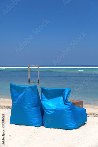 Colored sunbed under the tree in ocean view of Indonesia, Gili Trawangan island. 