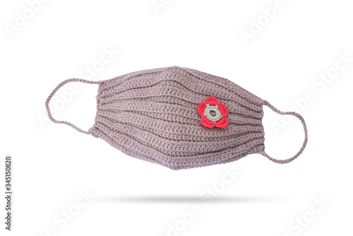 An image of colorful surgical mask made by handicraft with knitting crochet on white background with clipping path