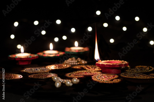 Lighting lamps during the festival of Diwali