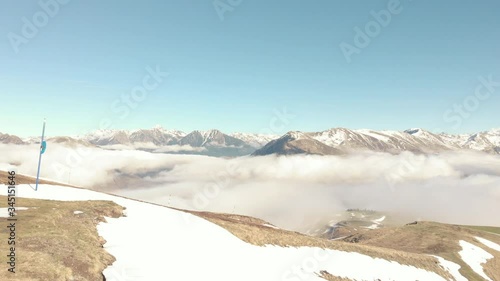 DRONE FOOTAGE - Snow and mountain peaks in the french Pyrenees near the Luchon Superbagnères Ski Resort in Saint-Aventin, France. The Luchonnais Mountains aerial view.