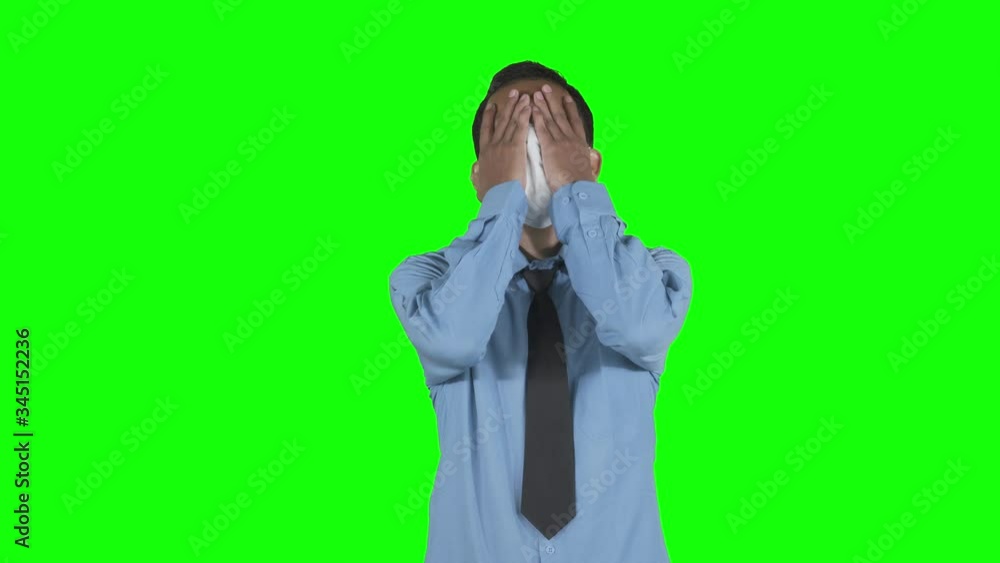 Stressful businessman standing and wearing mask Stressful businessman standing and wearing mask