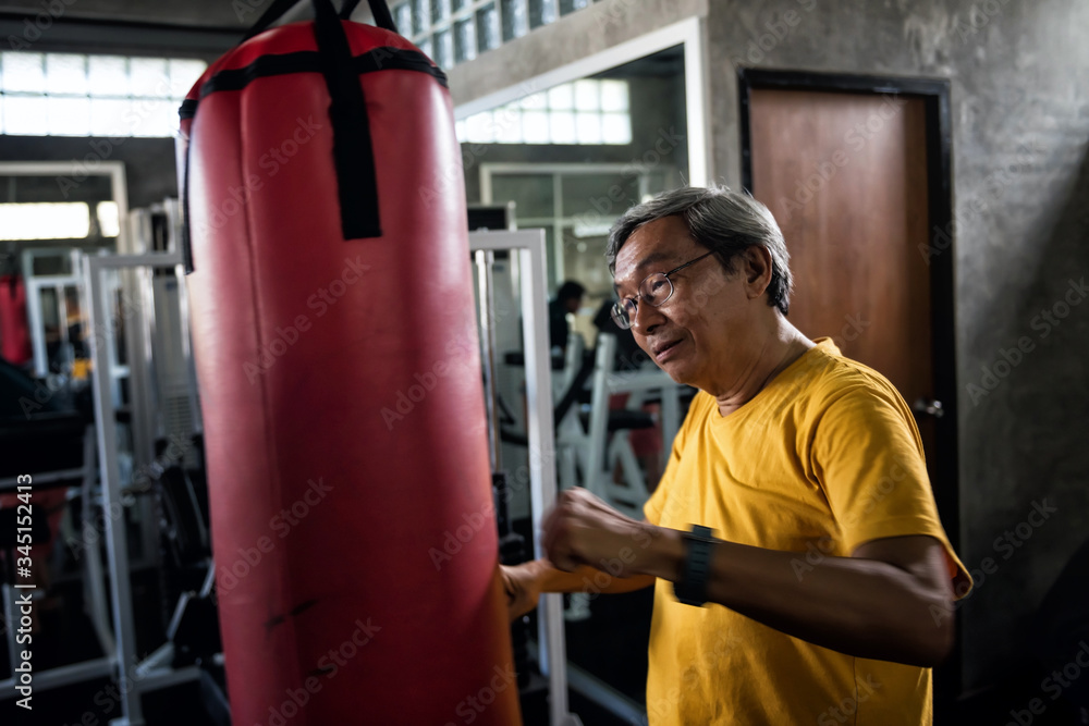 Old man train boxing alone during covid-19