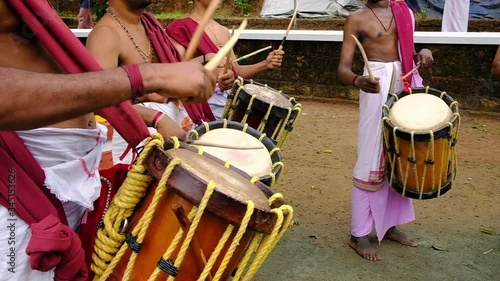 Indian men play traditional percussion instrument Chenda in Kerala, India  photo