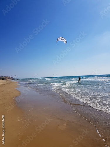 Kite surfer on the beach. Great for relaxing and relieving tension. This image have token with Samsung galaxy s8+ ! ! :) The photographer is 15 years old =)