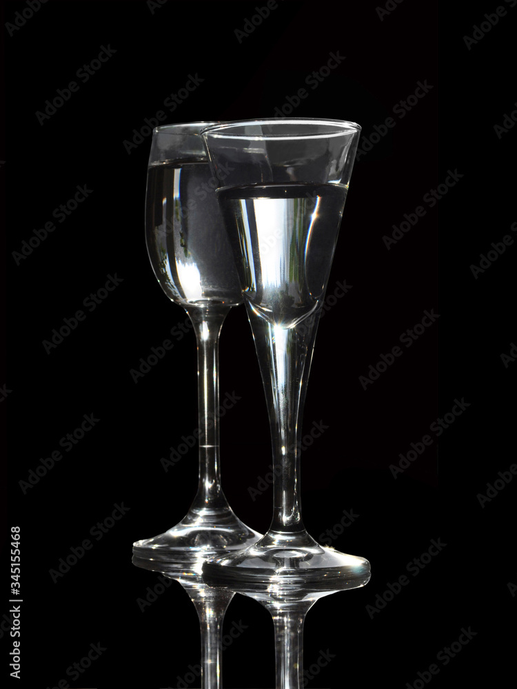 Glasses with a drink close-up on a black background Glasses with a drink close-up on a black background