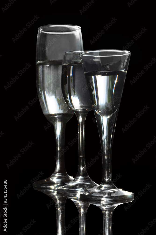 Glasses with a drink close-up on a black background Glasses with a drink close-up on a black background