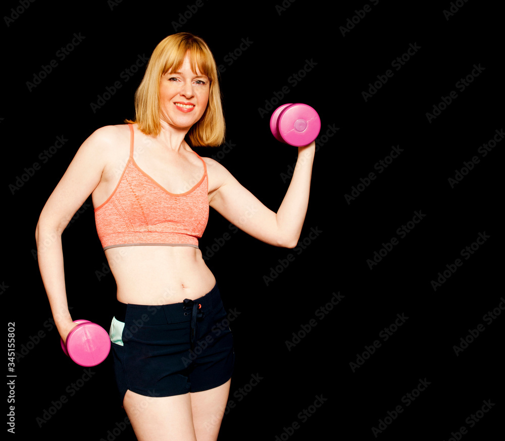 Fit woman exercising with free weights Fit woman exercising with free weights