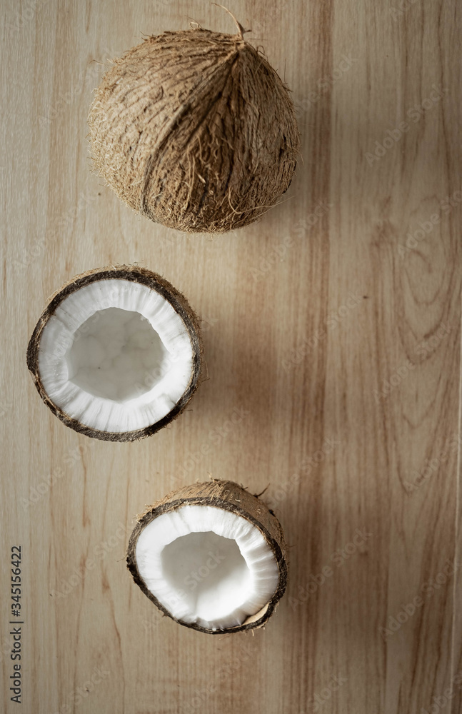 coconut on a wooden background, half a coconut