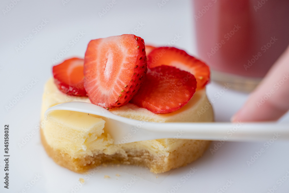 Spoon Takes a Piece of Delicious Strawberry Cheesecake Spoon Takes a Piece of Delicious Strawberry Cheesecake