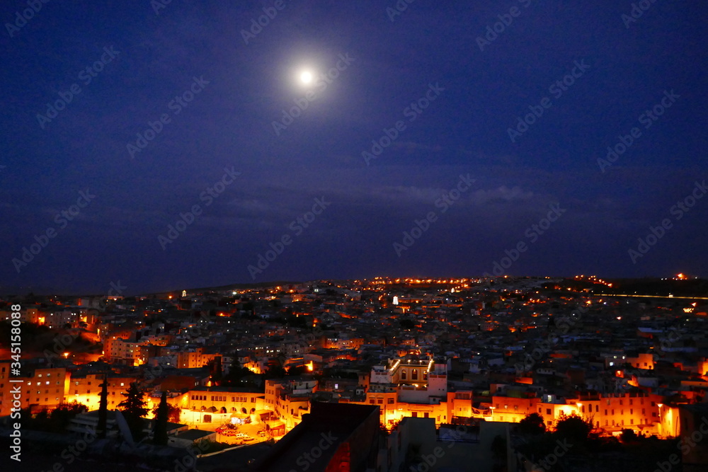 A unique and elegant night in Fes, Morocco, with a  stunning night view over the Medina.
